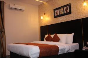 Letto o letti in una camera di Residency Hotel Lekki Phase 1