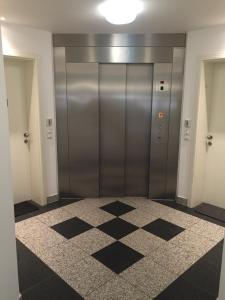 a hallway with two elevators in a building at Ferienwohnung in Bad Saarow in Bad Saarow