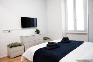 Postel nebo postele na pokoji v ubytování Casetta Garbatella