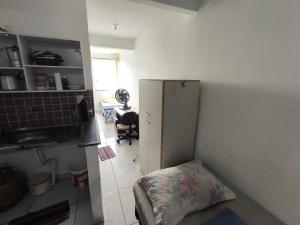 a kitchen with a small refrigerator in a room at Ed Falcão quadra 2 lote 7 AP 402 in Riacho Fundo +6 photos