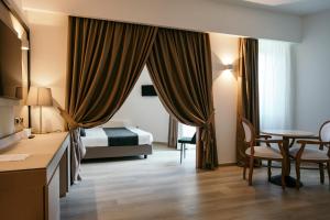 Postel nebo postele na pokoji v ubytování Grand Hotel la Chiusa di Chietri