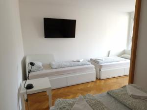 Ένα ή περισσότερα κρεβάτια σε δωμάτιο στο Heart of Ljubljana with free parking