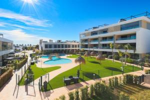 an aerial view of a building with a park at Casa Madreselva by Rental Hero in Las Casicas