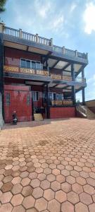 a large building with a balcony on top of it at Nesya 2 in Campaka +12 photos