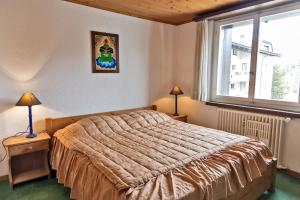 Postel nebo postele na pokoji v ubytování Chesa La Chatrigna - Celerina