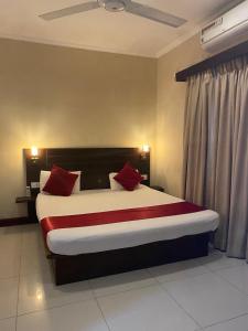 Postel nebo postele na pokoji v ubytování MercuryFM 101 Yarl Mercury Inn - Jaffna + 18 fotografií