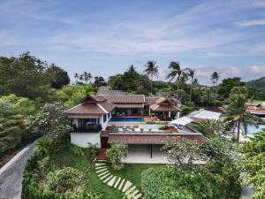 an aerial view of a house with a swimming pool at Anantara Lawana Koh Samui Resort in Chaweng
