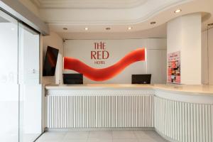 a restaurant with a red ribbon on the wall at The Red Hotel - Adults Only in San Antonio