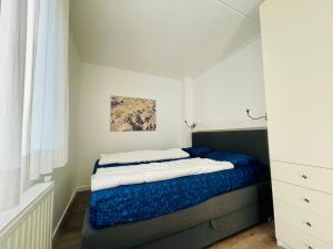 Ένα ή περισσότερα κρεβάτια σε δωμάτιο στο Heggerank 15C*