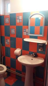 a bathroom with a sink and a mirror at Casa Carlo in Eforie Nord +26 photos