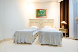 Cama o camas de una habitación en Hotel Permata Malioboro