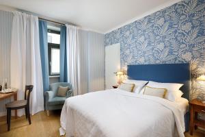 Postel nebo postele na pokoji v ubytování Hotel Goliath am Dom