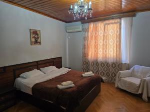 Postel nebo postele na pokoji v ubytování Hotel Cattaleya
