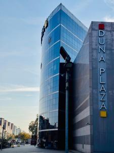 a building with a sign on the side of it at CityLink Nest Budapest - Free garage, AC & metro access in Budapest