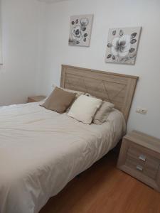 Ένα ή περισσότερα κρεβάτια σε δωμάτιο στο Vivienda A Fonte