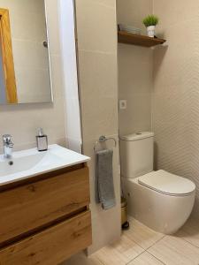 a bathroom with a toilet and a sink at Aire de Oceano in Costa de Antigua +20 photos