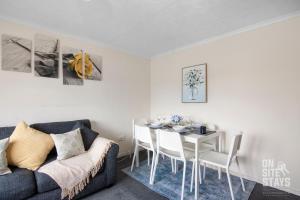 a living room with a couch and a table at Contractors 4 Bed with Parking in Hatfield