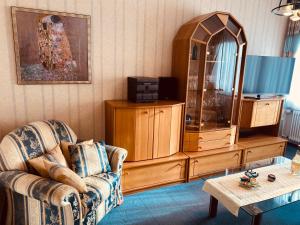 a living room with a couch and a dresser at Haus Nachtsheim in Bad Neuenahr-Ahrweiler