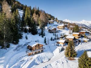 an aerial view of a resort in the snow at Chalet 18 îles Luxury chalet With Sauna La Tzoumaz in Riddes