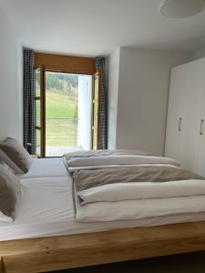 Ένα ή περισσότερα κρεβάτια σε δωμάτιο στο Ferienwohnung mit privater Sauna und direktem Zugang zur Skipiste