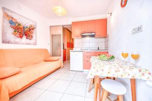 a living room with a couch and a table at Apartment Ennio in Povlja