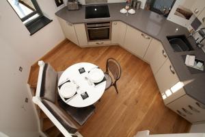an overhead view of a kitchen with a table and chairs at The Observatory Tower in Falmouth
