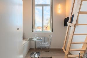 Μια τηλεόραση ή/και κέντρο ψυχαγωγίας στο Studio pour deux personnes en mezzanine +11 φωτογραφίες