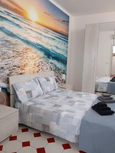 Postel nebo postele na pokoji v ubytování Nuovo bilocale a 100 mt dal mare