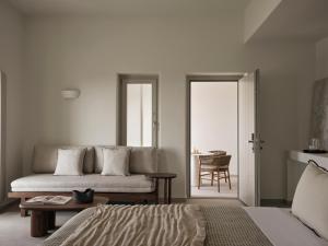 a bedroom with a bed and a table and a chair at Ark in Pirgos