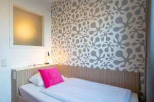 Letto o letti in una camera di Hotel Madeleine Biohotel