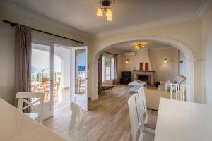 a kitchen and living room with a view of the ocean at San Jaime View - stunning sea views close to resort in Son Bou