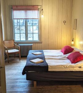 Postel nebo postele na pokoji v ubytování STF Sala Silvergruva Vandrarhem