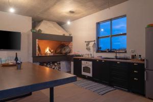 a kitchen with a stove and a fireplace at Beautiful Villa Aria in Zadar