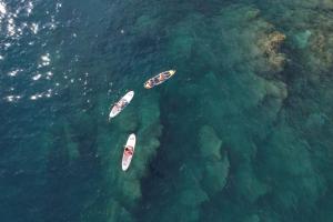 a group of three boats in the water at Grand Hotel Bristol Spa Resort, by R Collection Hotels in Rapallo
