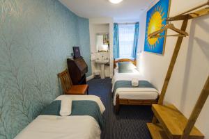 Postel nebo postele na pokoji v ubytování St Athans Hotel