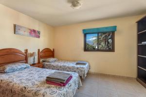 Ένα ή περισσότερα κρεβάτια σε δωμάτιο στο Big 2-bedroom in Tenerife South +22 φωτογραφίες