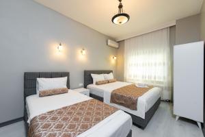 Postel nebo postele na pokoji v ubytování Galley Port Hotel