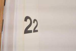 a sign on a door with the number on it at Harford House studios 22 - Hopewell in Bristol