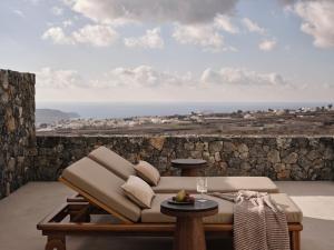 a living room with a couch and a table at Ark in Pirgos