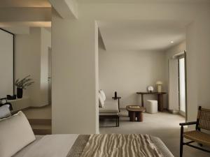 a bedroom with a bed and a chair at Ark in Pirgos