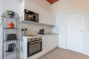 Η κουζίνα ή μικρή κουζίνα στο Studio équipé côté rue, parking gratuit