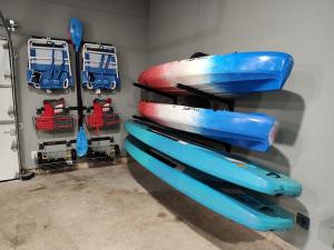 a group of kayaks sitting on a shelf in a room at Shady Shores Lake House - Hot Tub Dog-Friendly in Shady Shores