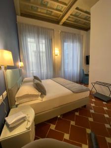 Postel nebo postele na pokoji v ubytování Hotel Atlantic Palace