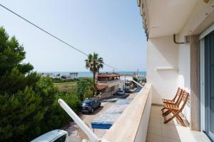 a balcony with a view of the ocean at Vista Mare Paradiso by Salento Prime in Torre Vado