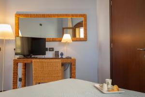 Postel nebo postele na pokoji v ubytování Hotel Cetarium