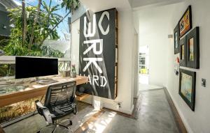 an office with a desk and a computer on a wall at The Number 41 in Rivière Noire