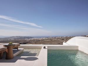 a view of the ocean from the balcony of a house at Ark in Pirgos
