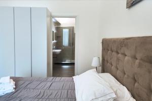A bed or beds in a room at Home De Curtis