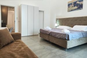 A bed or beds in a room at Home De Curtis