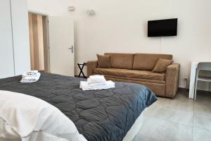 A bed or beds in a room at Home De Curtis